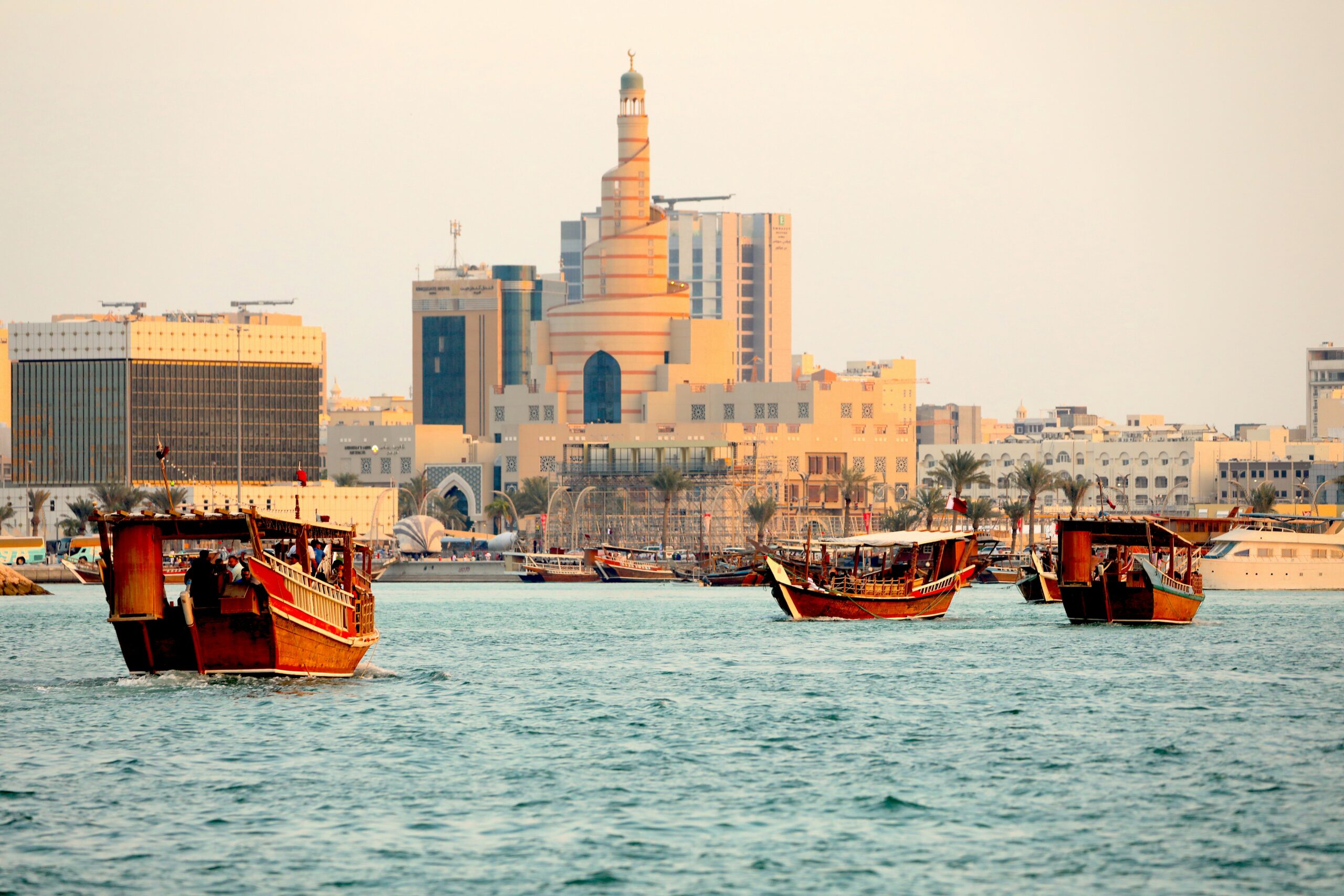 Boats along the Doha Corniche in Qatar. Photo by Rahul Joglekar on Unsplash.